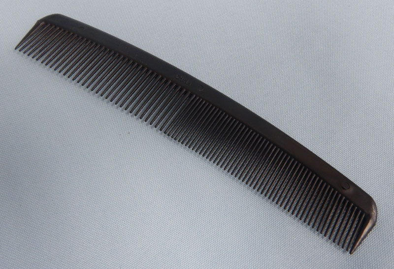 black plastic long comb